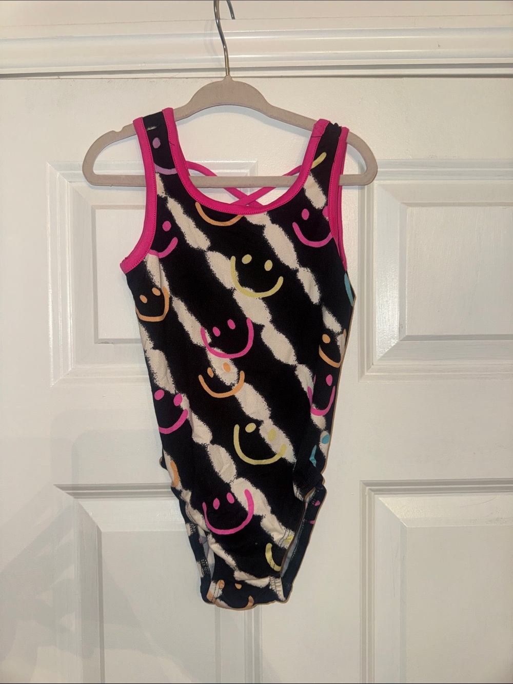 Pixielane Black Smiley Print One-Piece bodysuit with Pink Trim
